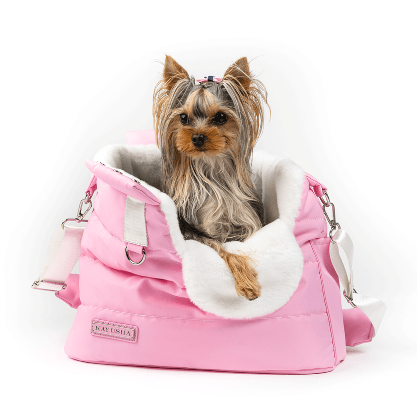 Navy blue pet carrier with pink plush interior